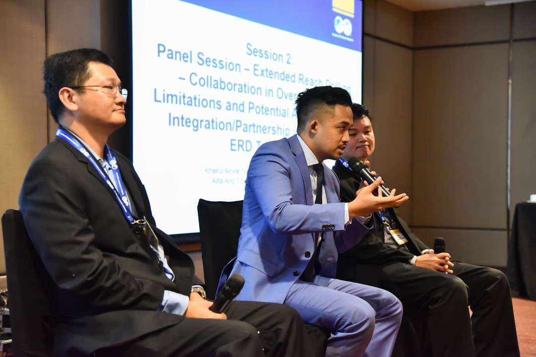 Confident speaker on a panel, subtly enhanced by a captivating pheromone cologne.